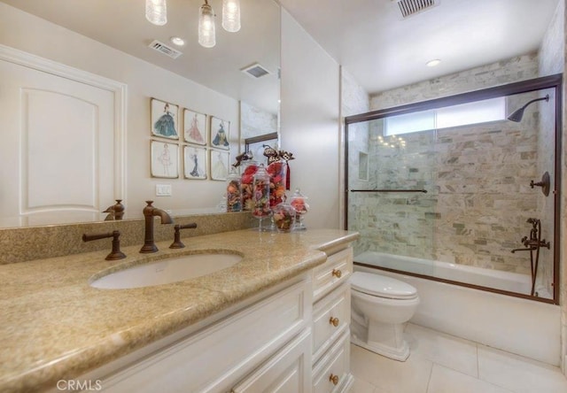 full bathroom with vanity, toilet, combined bath / shower with glass door, and tile patterned flooring