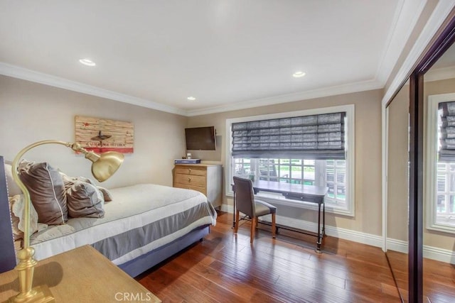 bedroom featuring a closet, ornamental molding, and dark hardwood / wood-style floors