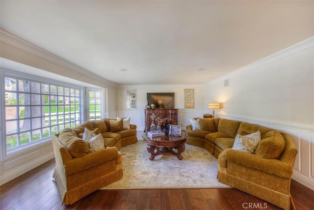 living room with ornamental molding and dark hardwood / wood-style floors