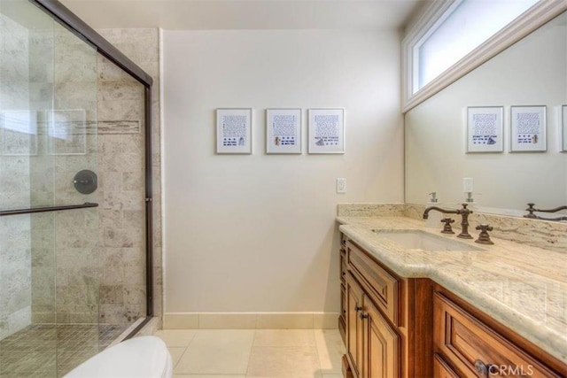 bathroom featuring walk in shower, tile patterned flooring, vanity, and toilet