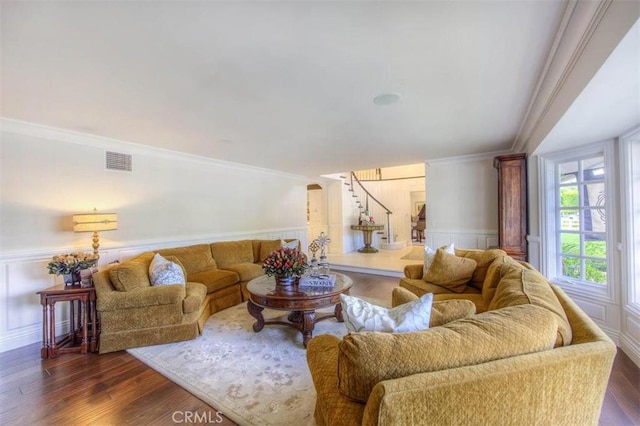 living room featuring ornamental molding and dark hardwood / wood-style floors