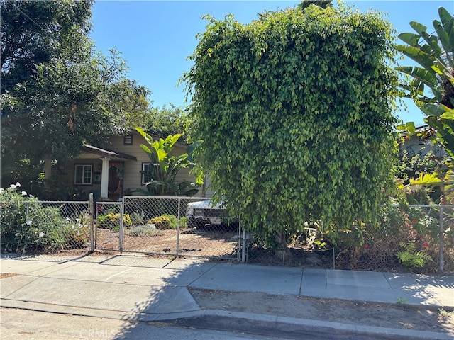 view of property hidden behind natural elements