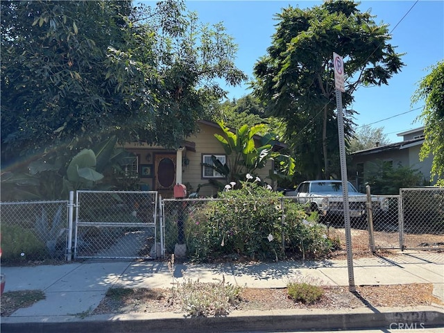 2724 Queen St, Los Angeles, CA 90039 - obstructed view of property featuring a fenced front yard and a gate