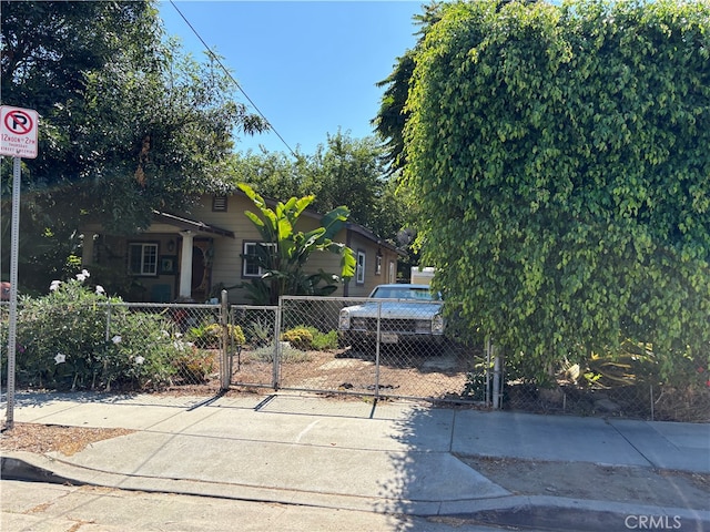 view of property hidden behind natural elements