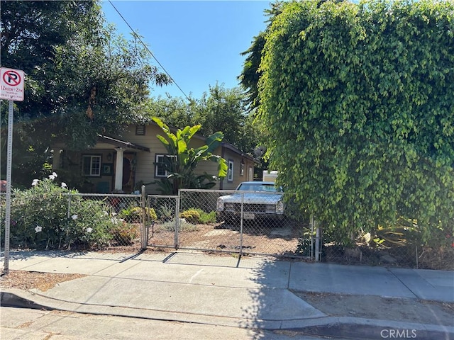 2724 Queen St, Los Angeles, CA 90039 - view of front facade featuring a fenced front yard, a gate, and driveway