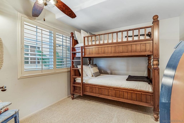 bedroom featuring light colored carpet and ceiling fan