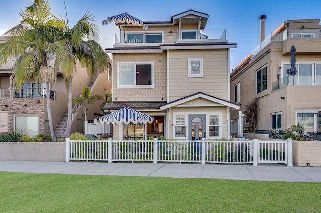 view of front facade featuring a front yard and french doors