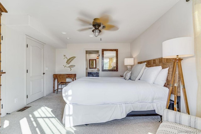 bedroom with ceiling fan and light colored carpet