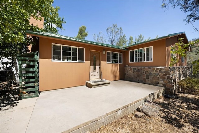 single story home featuring a patio