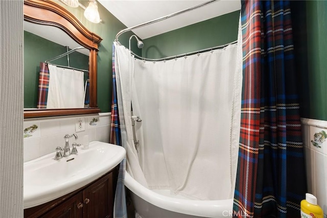 bathroom with vanity, shower / tub combo, and tasteful backsplash