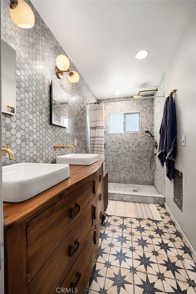 bathroom featuring vanity and walk in shower