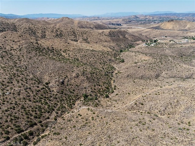 drone / aerial view featuring a mountain view