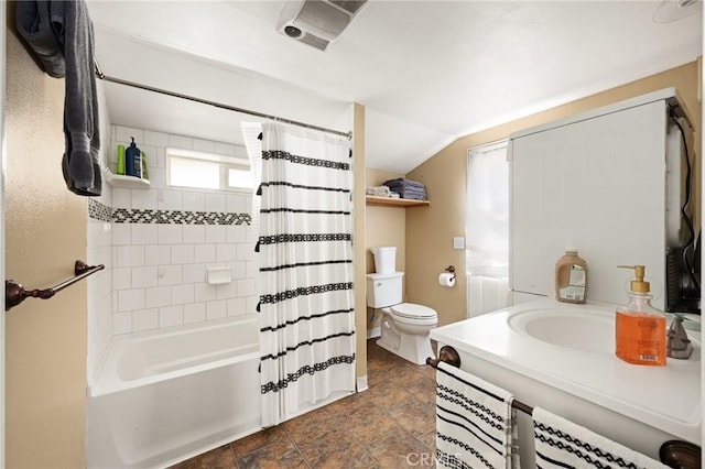 full bathroom with shower / bath combo with shower curtain, vanity, vaulted ceiling, and toilet