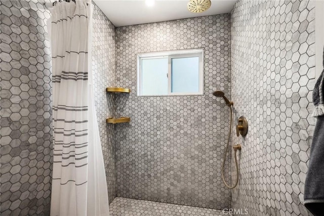 bathroom with a shower with shower curtain