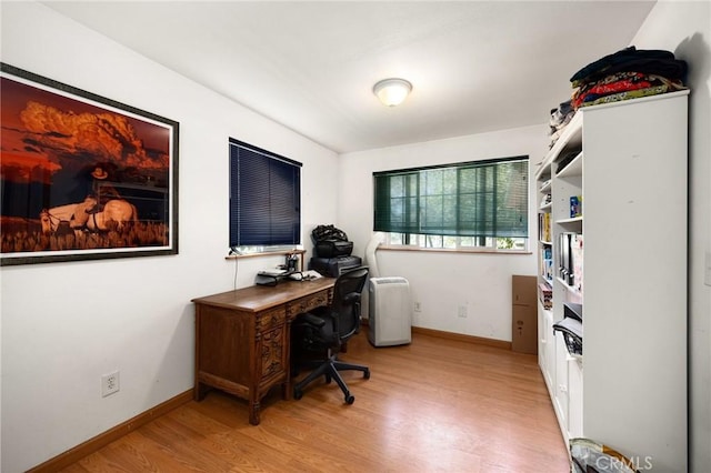 home office featuring light hardwood / wood-style floors