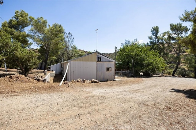 view of property exterior featuring an outdoor structure