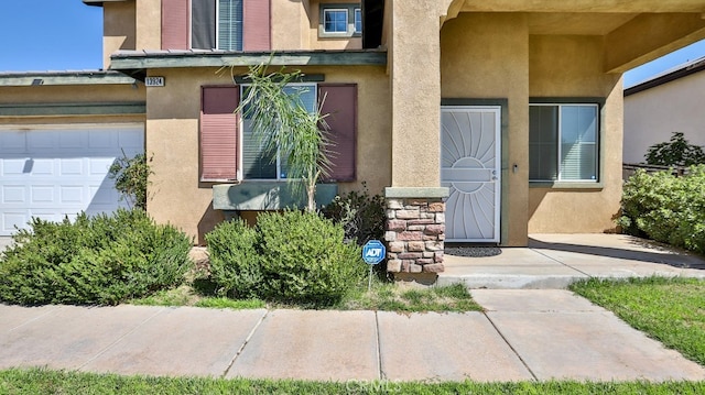 property entrance with a garage