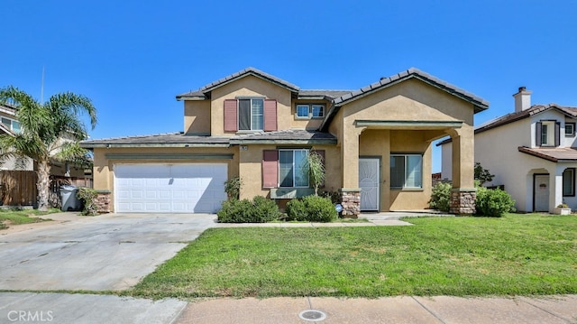 view of front of home featuring a front lawn and a garage