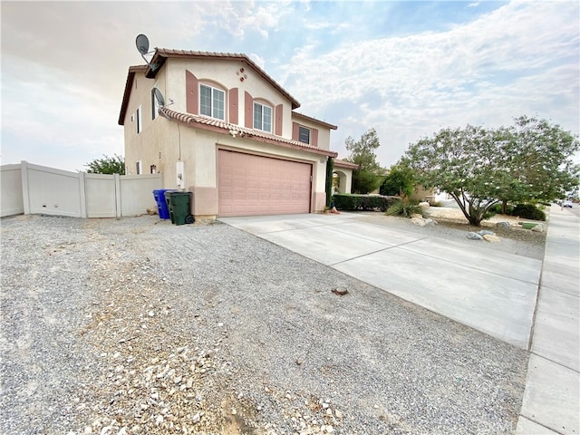 view of side of property with a garage