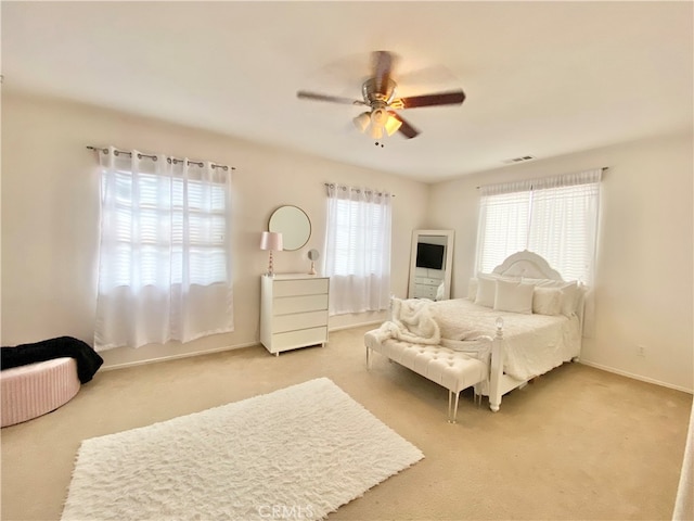 bedroom featuring ceiling fan and light colored carpet