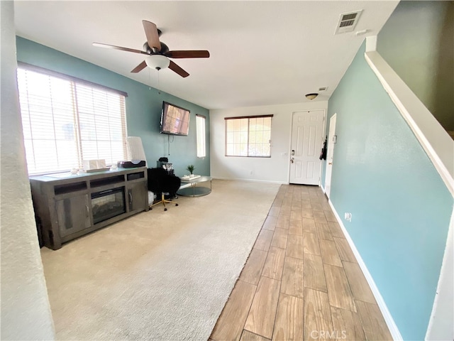 office space featuring light hardwood / wood-style flooring and ceiling fan