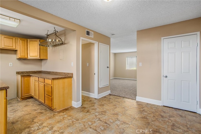 kitchen featuring a textured ceiling