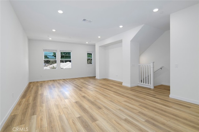 spare room featuring light hardwood / wood-style flooring