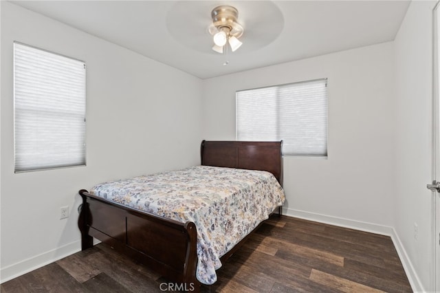 bedroom with ceiling fan and dark wood-type flooring