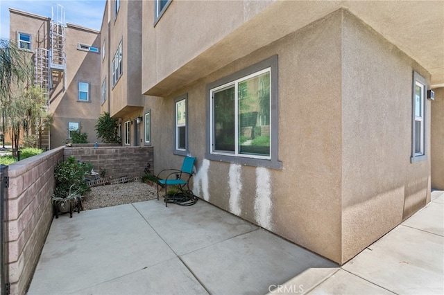 view of side of home with a patio