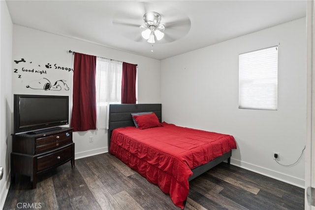 bedroom with ceiling fan and dark hardwood / wood-style floors