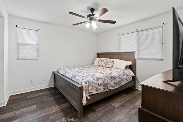 bedroom with ceiling fan and dark wood-type flooring