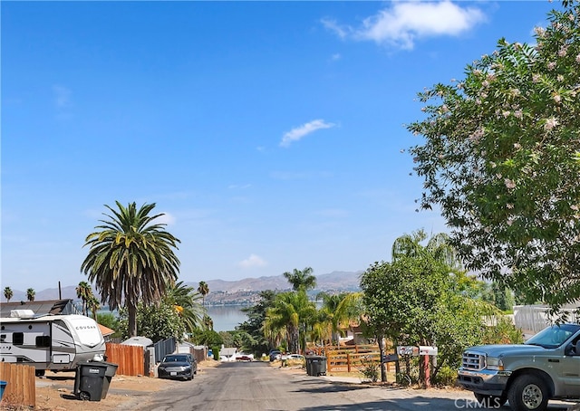 view of street featuring a water and mountain view