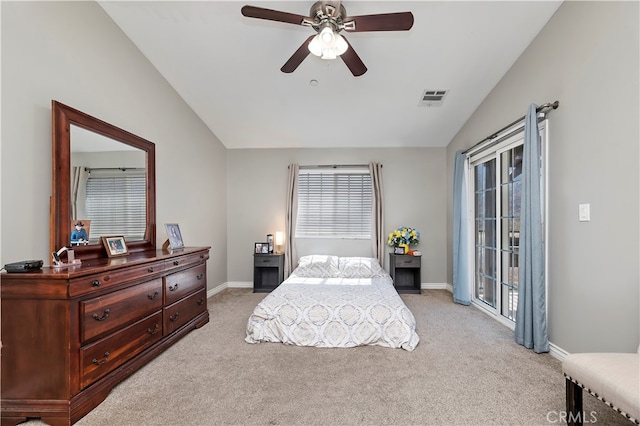 carpeted bedroom featuring multiple windows, vaulted ceiling, and ceiling fan