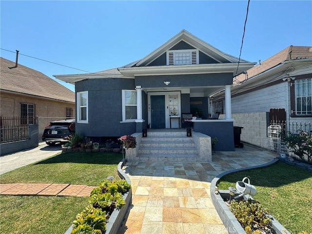 bungalow-style home featuring a front lawn