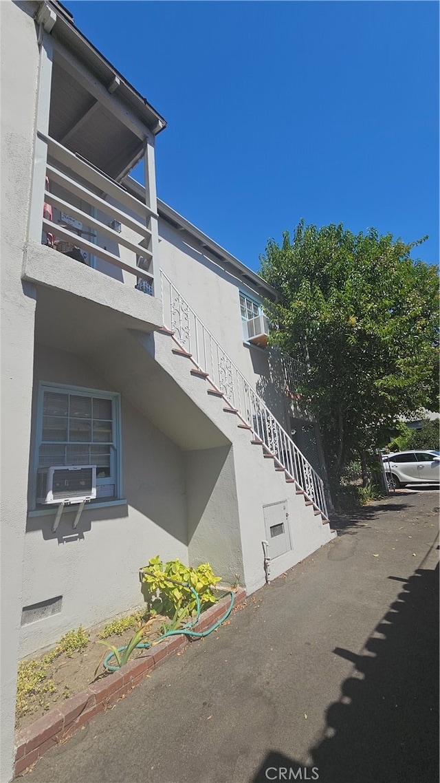 view of side of property featuring a balcony