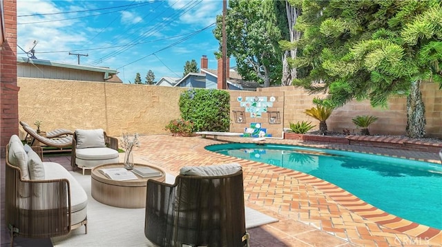 view of swimming pool featuring a patio