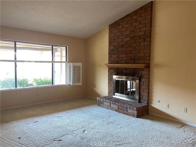 unfurnished living room featuring a textured ceiling, a fireplace, vaulted ceiling, and carpet flooring