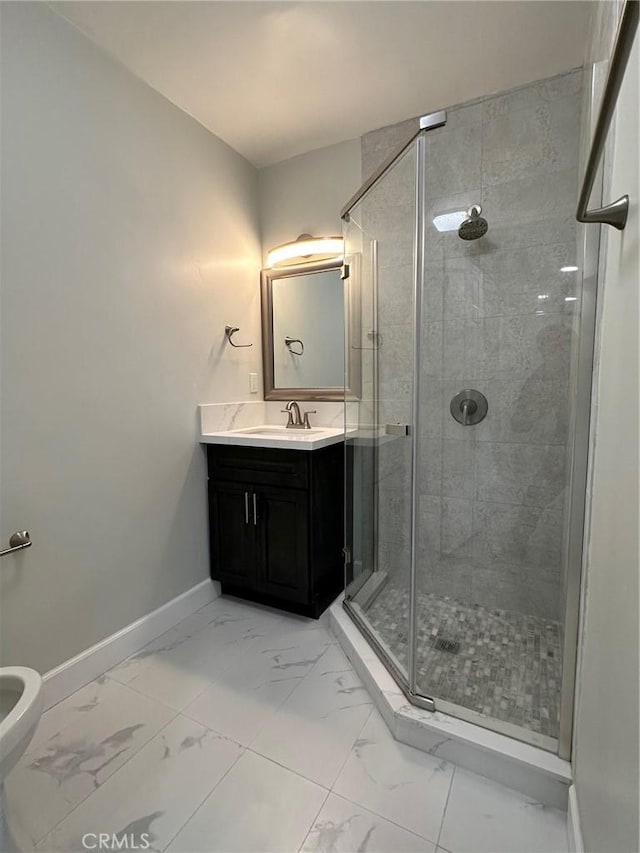 bathroom featuring vanity and a shower with shower door