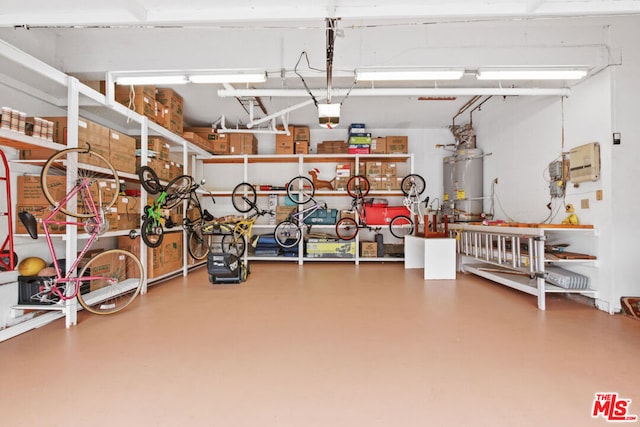 garage featuring secured water heater and a workshop area