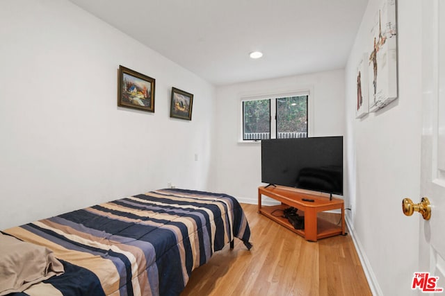 bedroom with light wood-type flooring