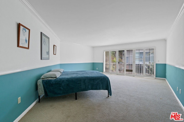 carpeted bedroom featuring crown molding