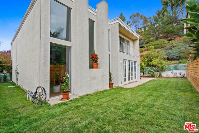 view of property exterior featuring a yard