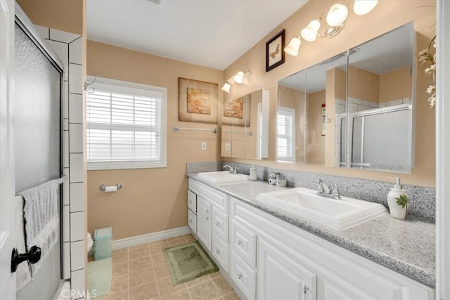 bathroom featuring vanity and a shower with shower door