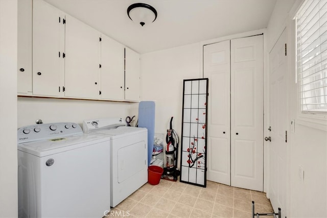 washroom with cabinets and independent washer and dryer