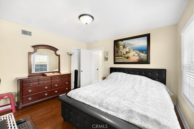 bedroom featuring dark wood-type flooring