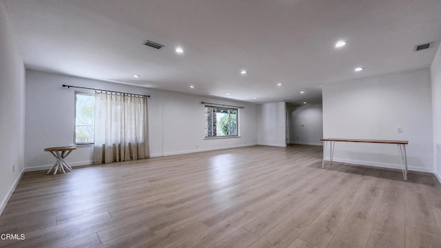 unfurnished living room featuring light wood-type flooring