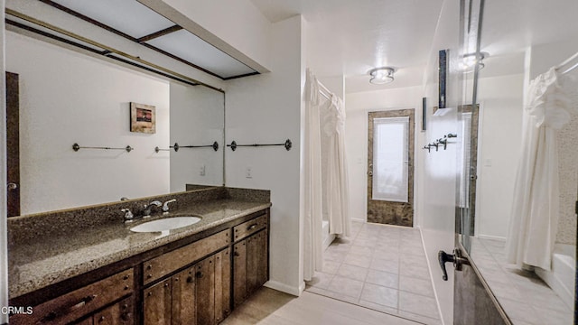 bathroom featuring tile patterned floors and vanity