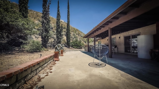 view of patio / terrace with a mountain view