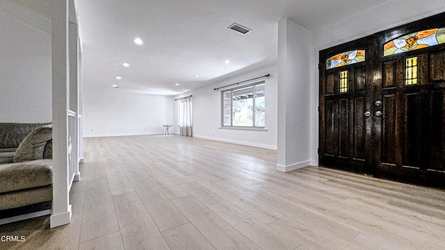 entryway with light hardwood / wood-style floors