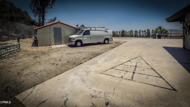 exterior space with a shed